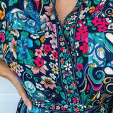 Close-up of Truly Madly custom print on Alison Shirt Dress – peacock & floral detail in navy
