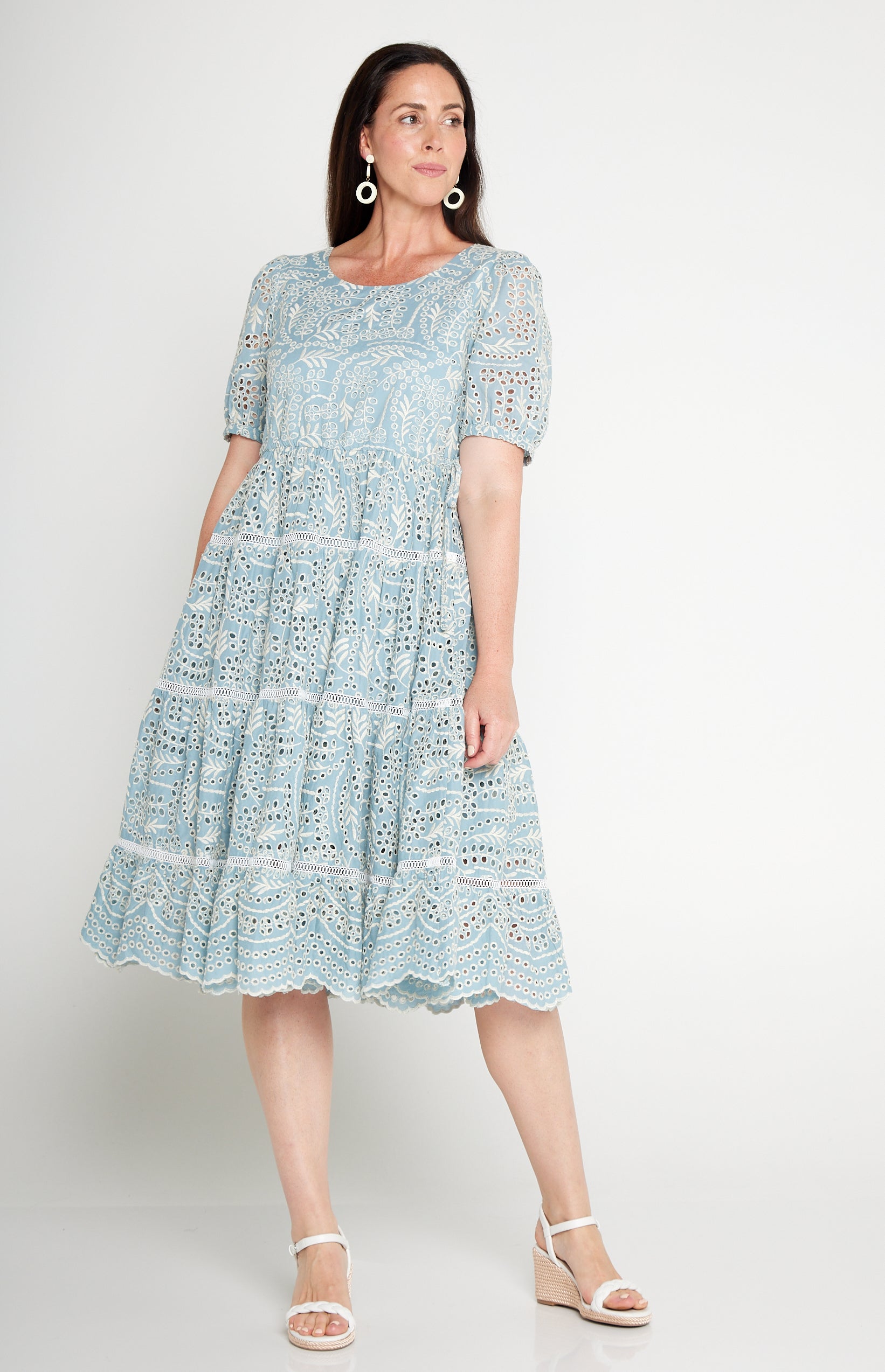 Model wearing Eloise Dress in blue lace – waist-accentuating, adjustable drawstring fit-and-flare style
