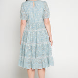 Back view of Eloise Dress in blue lace -waist-accentuating, adjustable drawstring fit-and-flare style