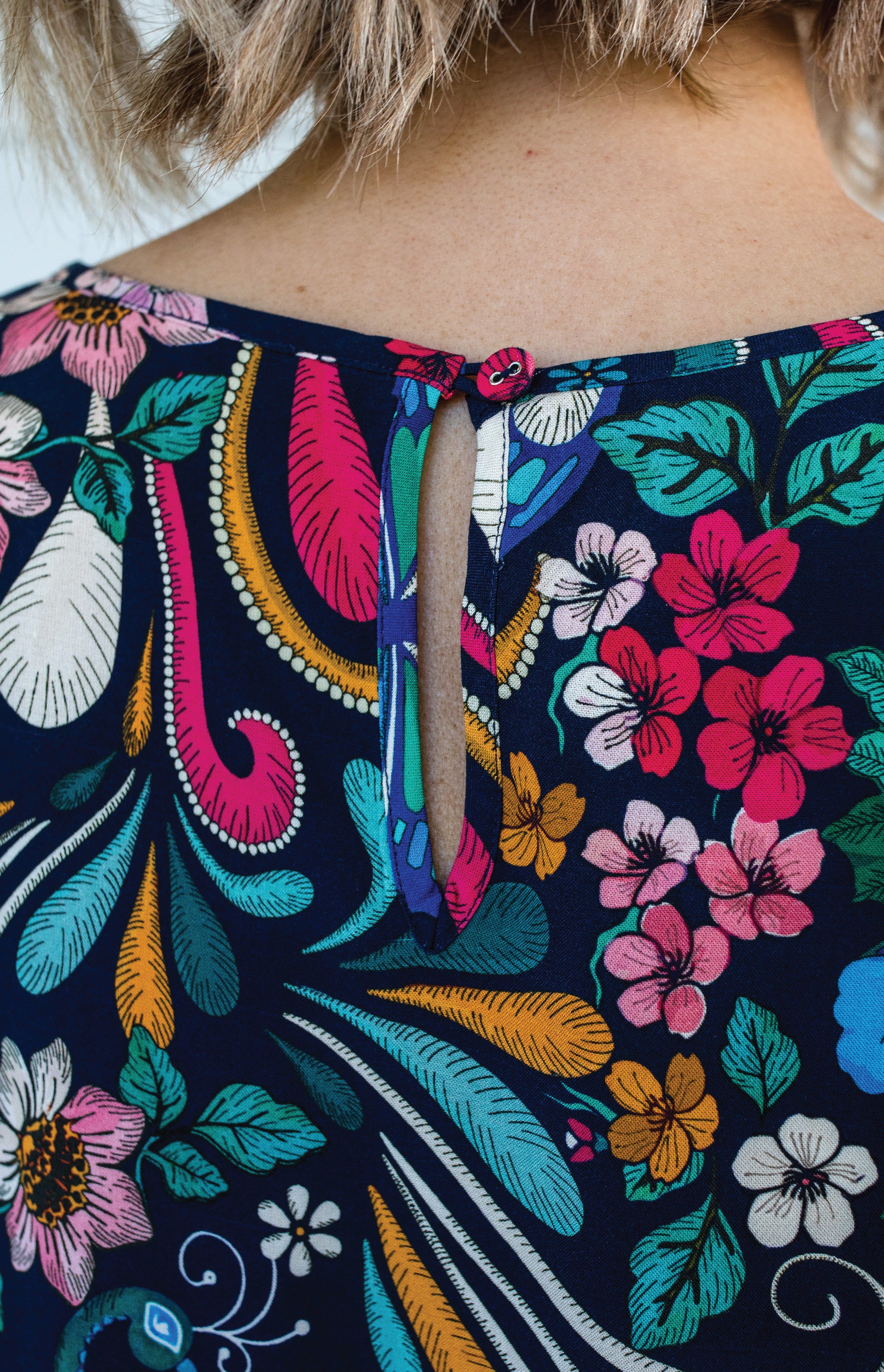 Button and keyhole detail at back neck of Poppy Top bestselling truly madly print
