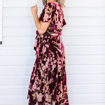Side view of Violet Dress in blossom wine velvet – tie belt and flowing skirt