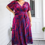 Maiocchi Violet dress in cornflower blue velvet – elegant wrap-style evening dress