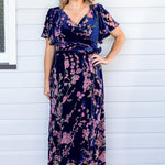 Maiocchi Violet Dress in blossom blue velvet – elegant flared wrap-style evening dress