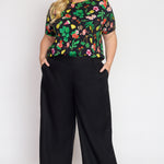 Model wearing Bianca Pant in black – high-rise waist and relaxed straight silhouette