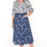  Maiocchi's Cherry Blouse in ivory swoon, perfect for everyday or something more fancy, and features our exclusive print.