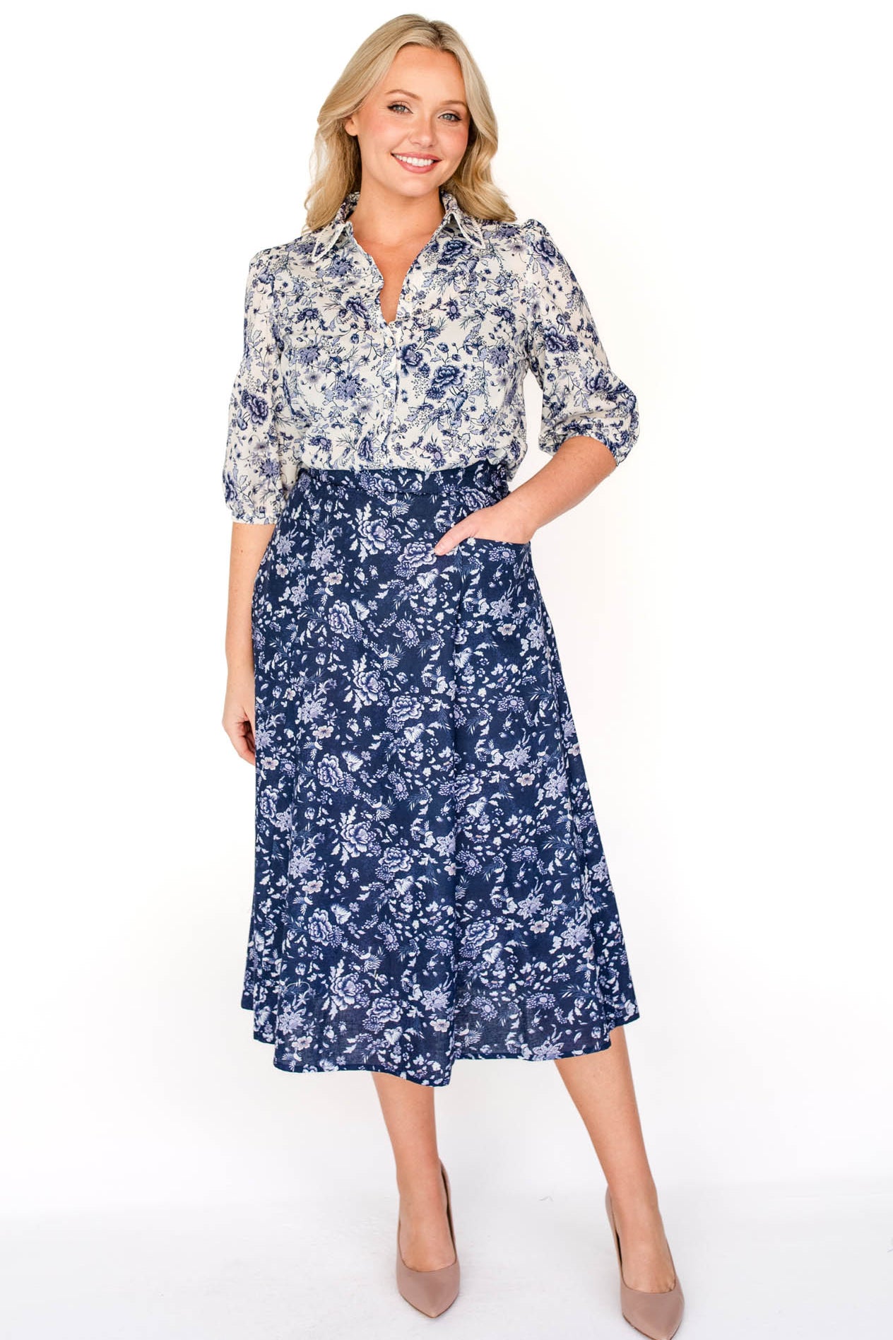  Maiocchi's Cherry Blouse in ivory swoon, perfect for everyday or something more fancy, and features our exclusive print.