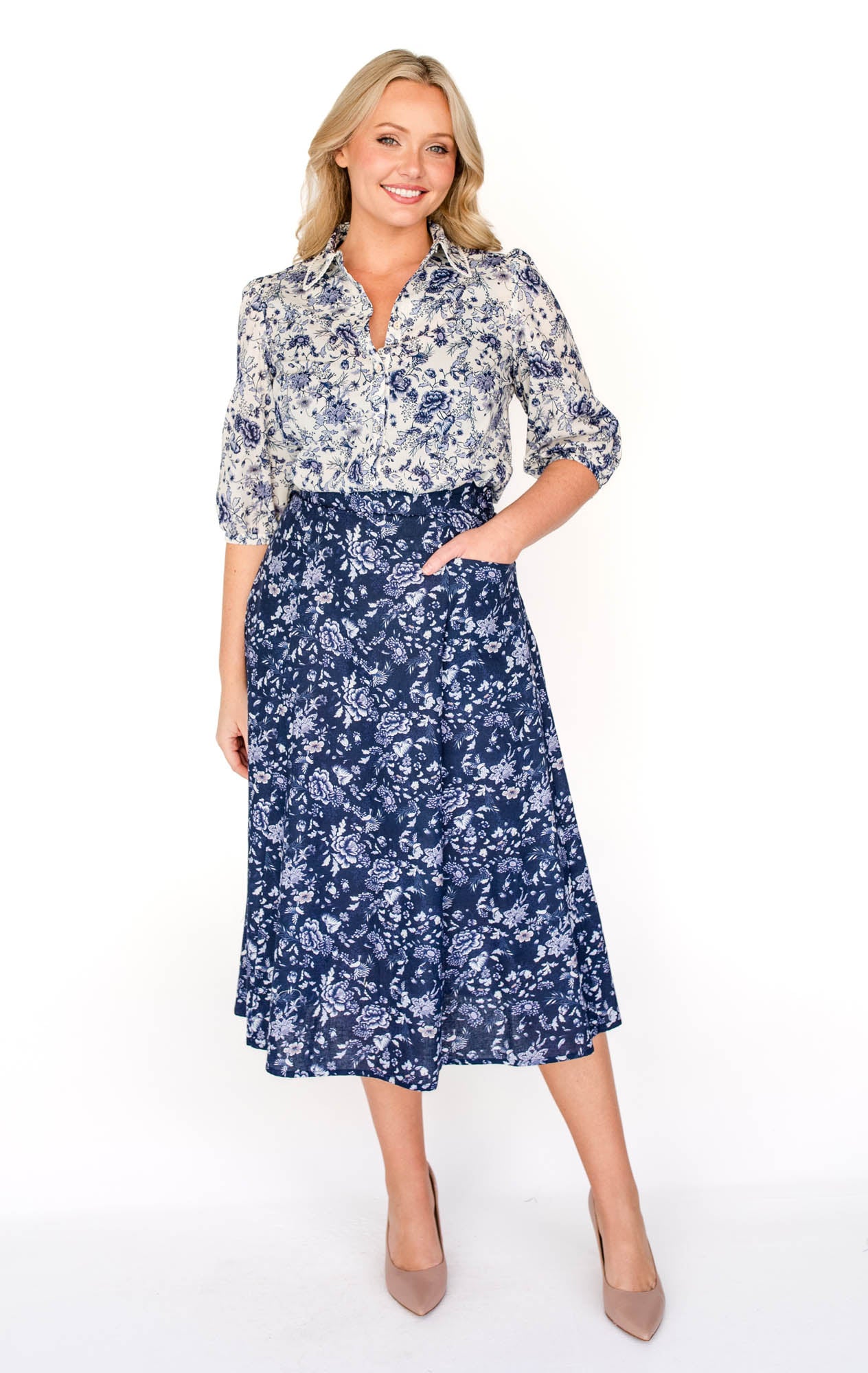  Maiocchi's Cherry Blouse in ivory swoon, perfect for everyday or something more fancy, and features our exclusive print.