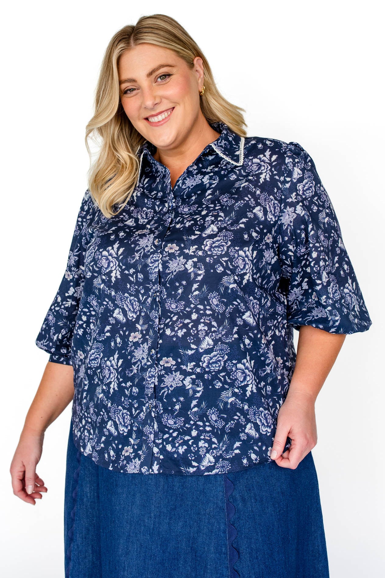  Maiocchi's Cherry Blouse in navy swoon, perfect for everyday or something more fancy, and features our exclusive print.