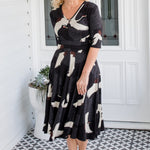 Cleo Dress in black Poetry in Motion print – nipped waist and twirly skirt