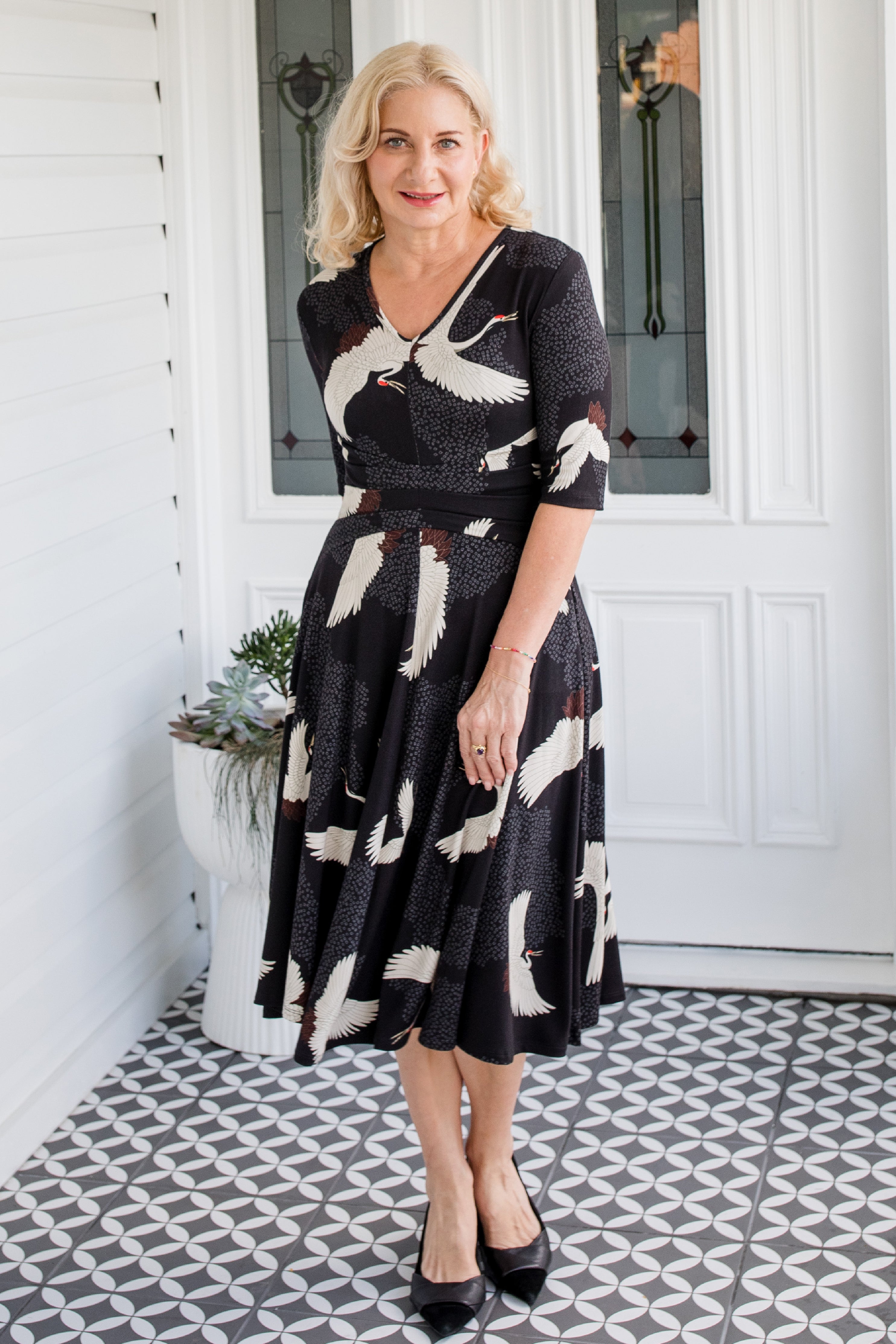 Cleo Dress in black Poetry in Motion print – nipped waist and twirly skirt