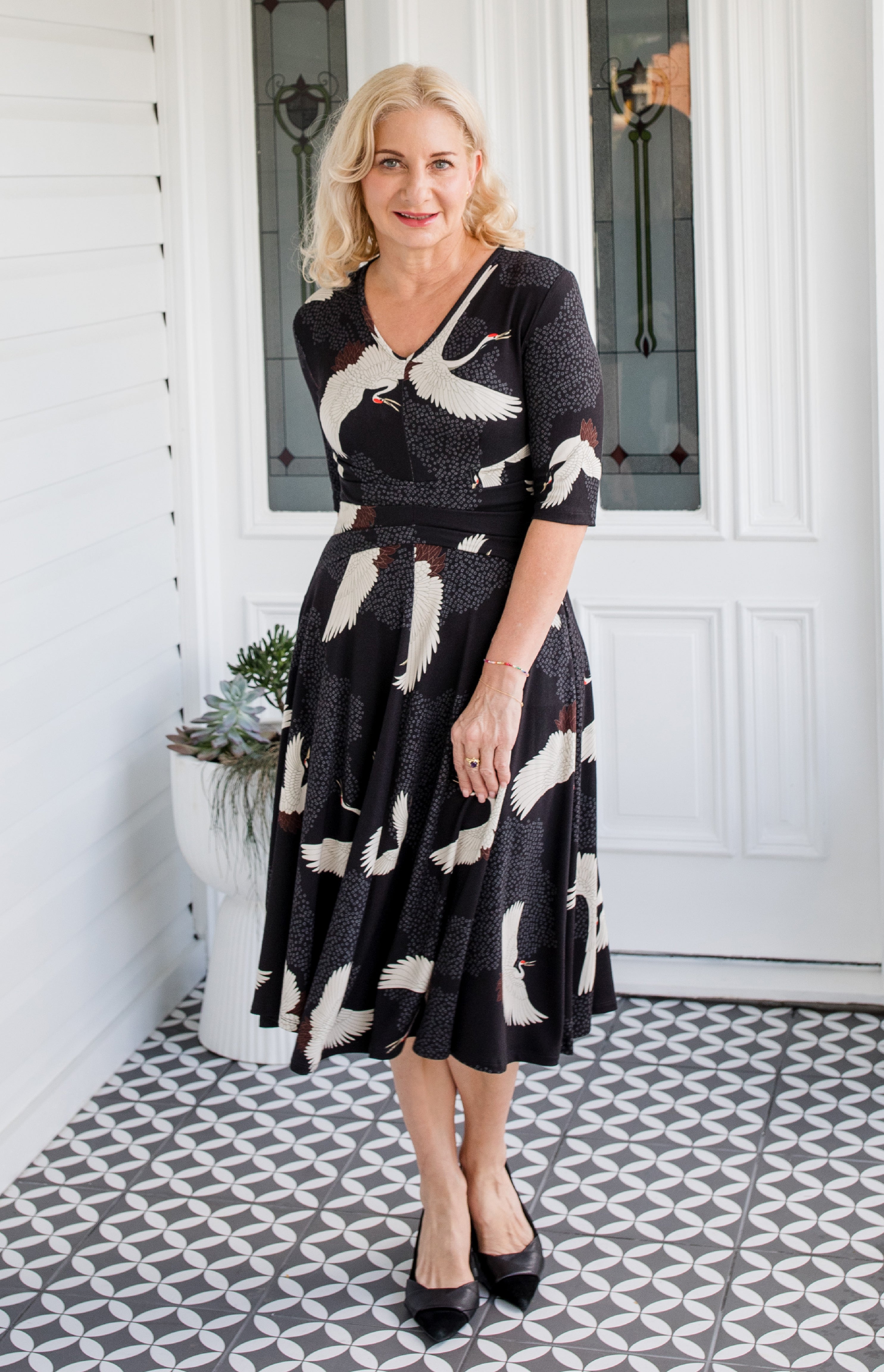 Cleo Dress in black Poetry in Motion print – nipped waist and twirly skirt