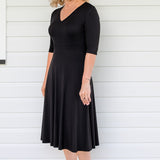 Cleo Dress in black – tuck-accented waist and twirly A-line skirt