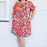 Crowd Pleaser Dress in name dropper red
