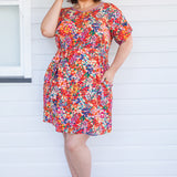 Crowd Pleaser Dress in name dropper red