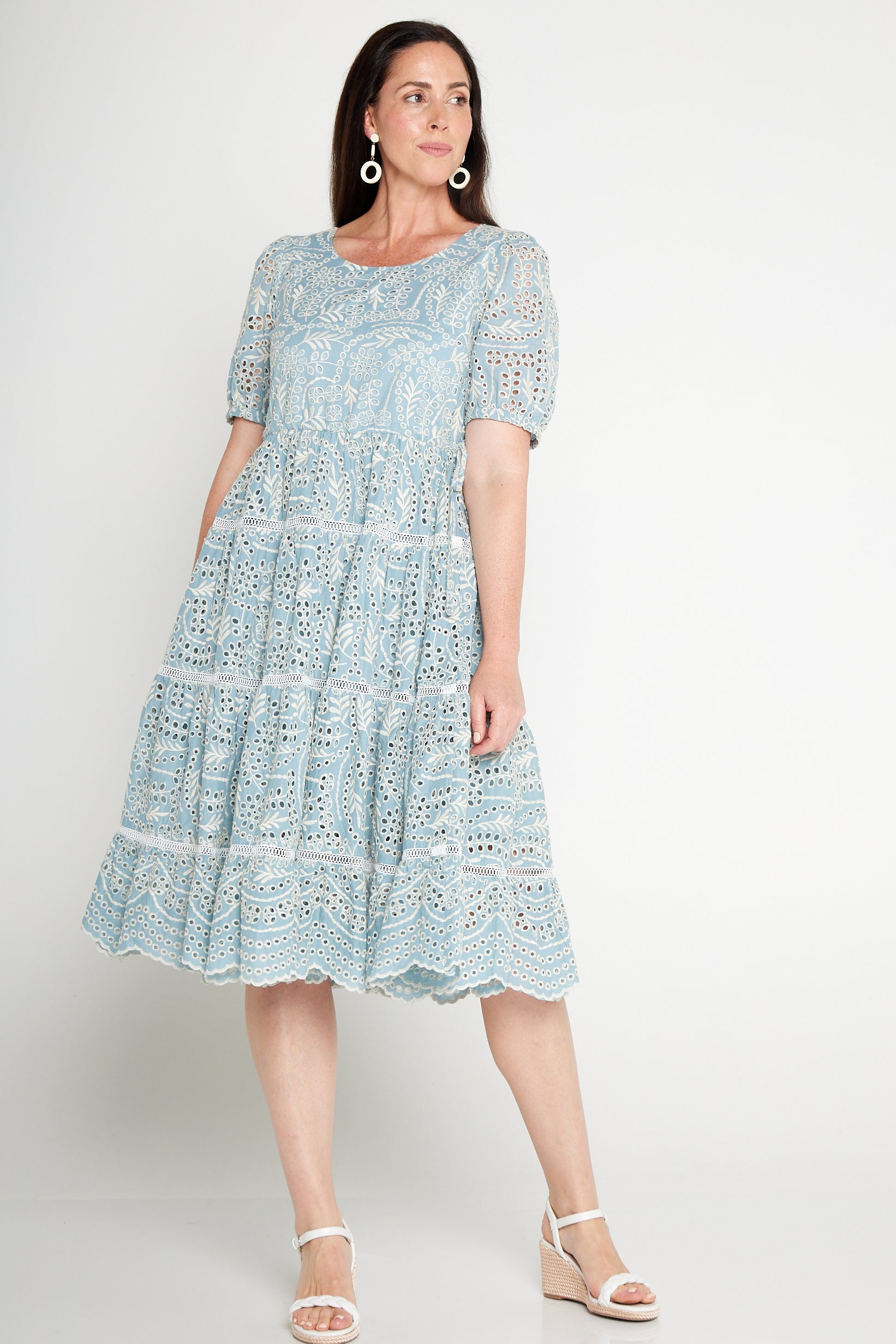 Model wearing Eloise Dress in blue lace – waist-accentuating, adjustable drawstring fit-and-flare style