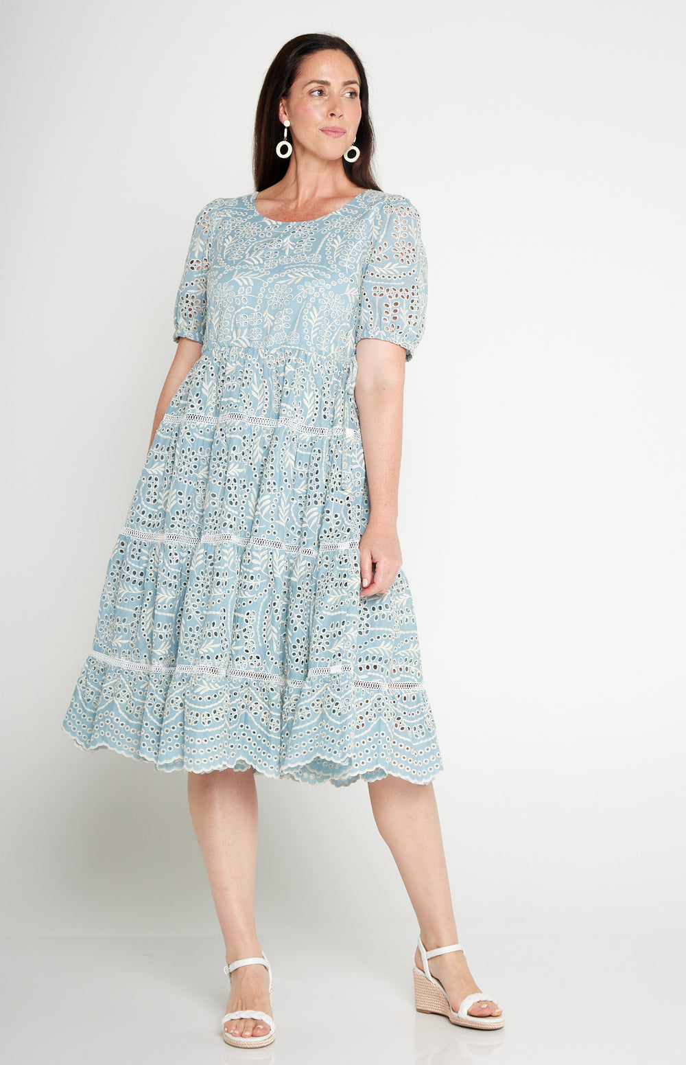 Model wearing Eloise Dress in blue lace – waist-accentuating, adjustable drawstring fit-and-flare style