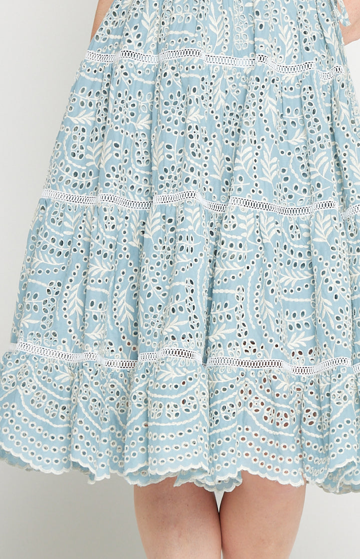 Close-up of embroidered cotton lace and ladder trim on Eloise Dress in blue lace