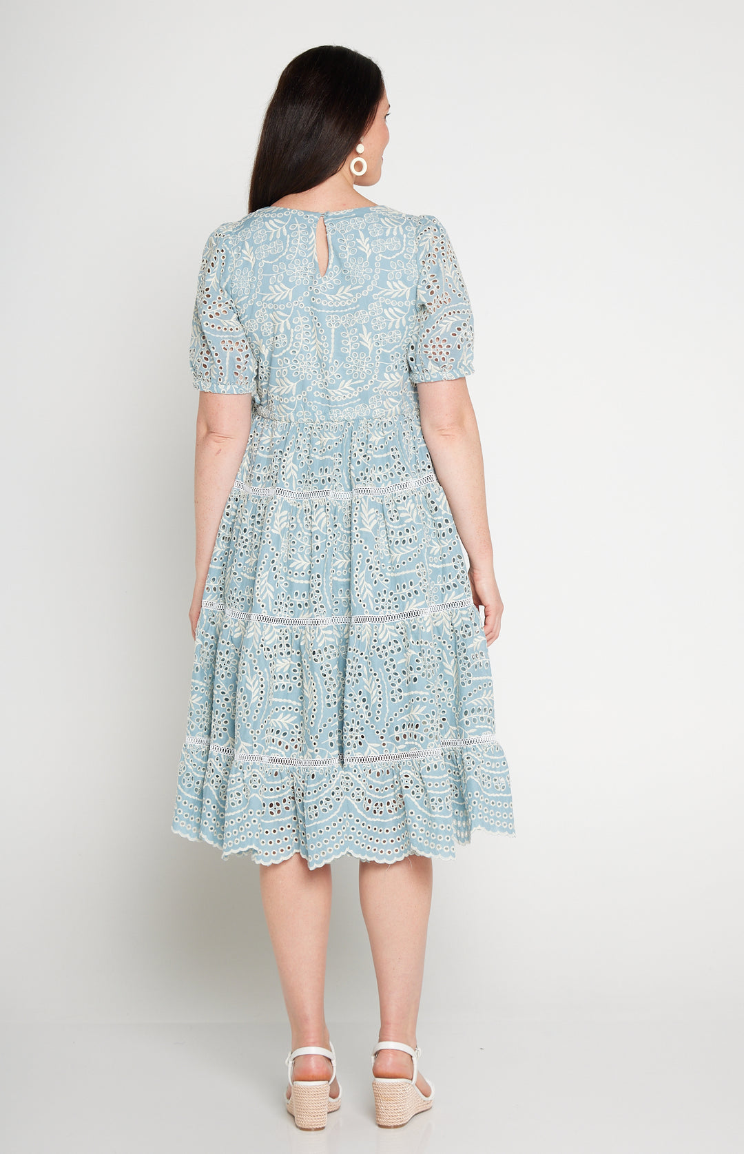 Back view of Eloise Dress in blue lace -waist-accentuating, adjustable drawstring fit-and-flare style