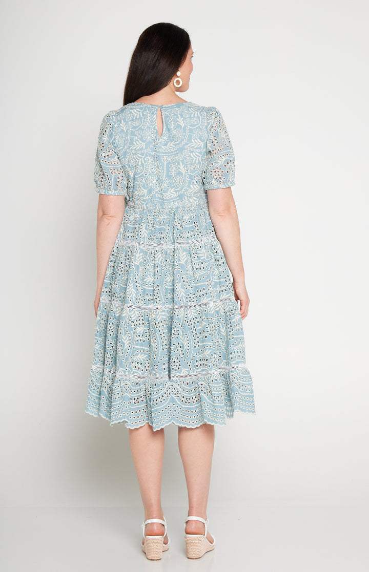 Back view of Eloise Dress in blue lace -waist-accentuating, adjustable drawstring fit-and-flare style