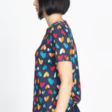 Holiday Tee in rainbow hearts