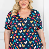 Holiday Tee V Neck in rainbow hearts