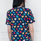 Holiday Tee V Neck in rainbow hearts