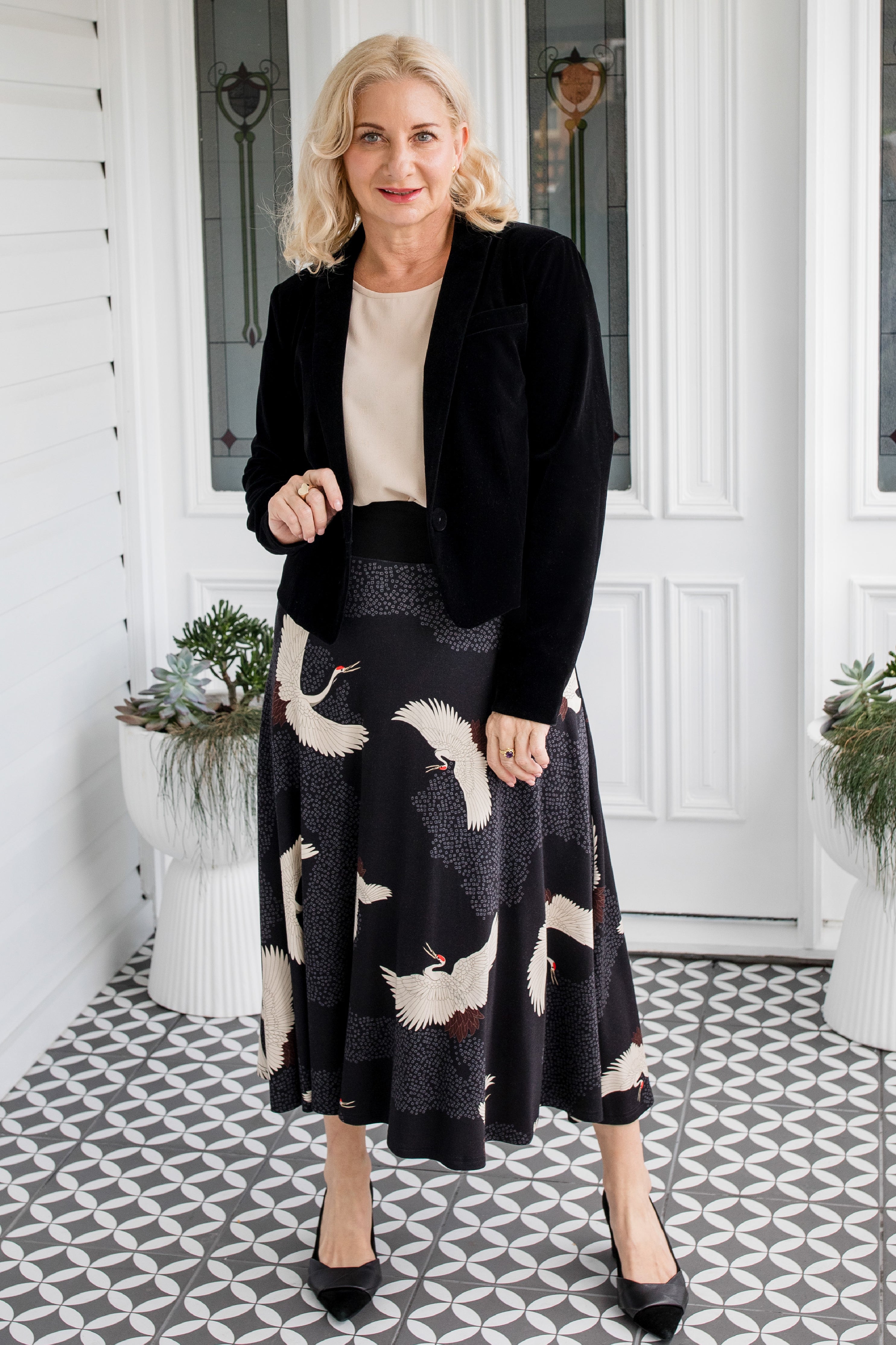 Model wearing Bamboo Must‑Have Skirt in Poetry in Motion black – flattering drape and stretch ponte waistband