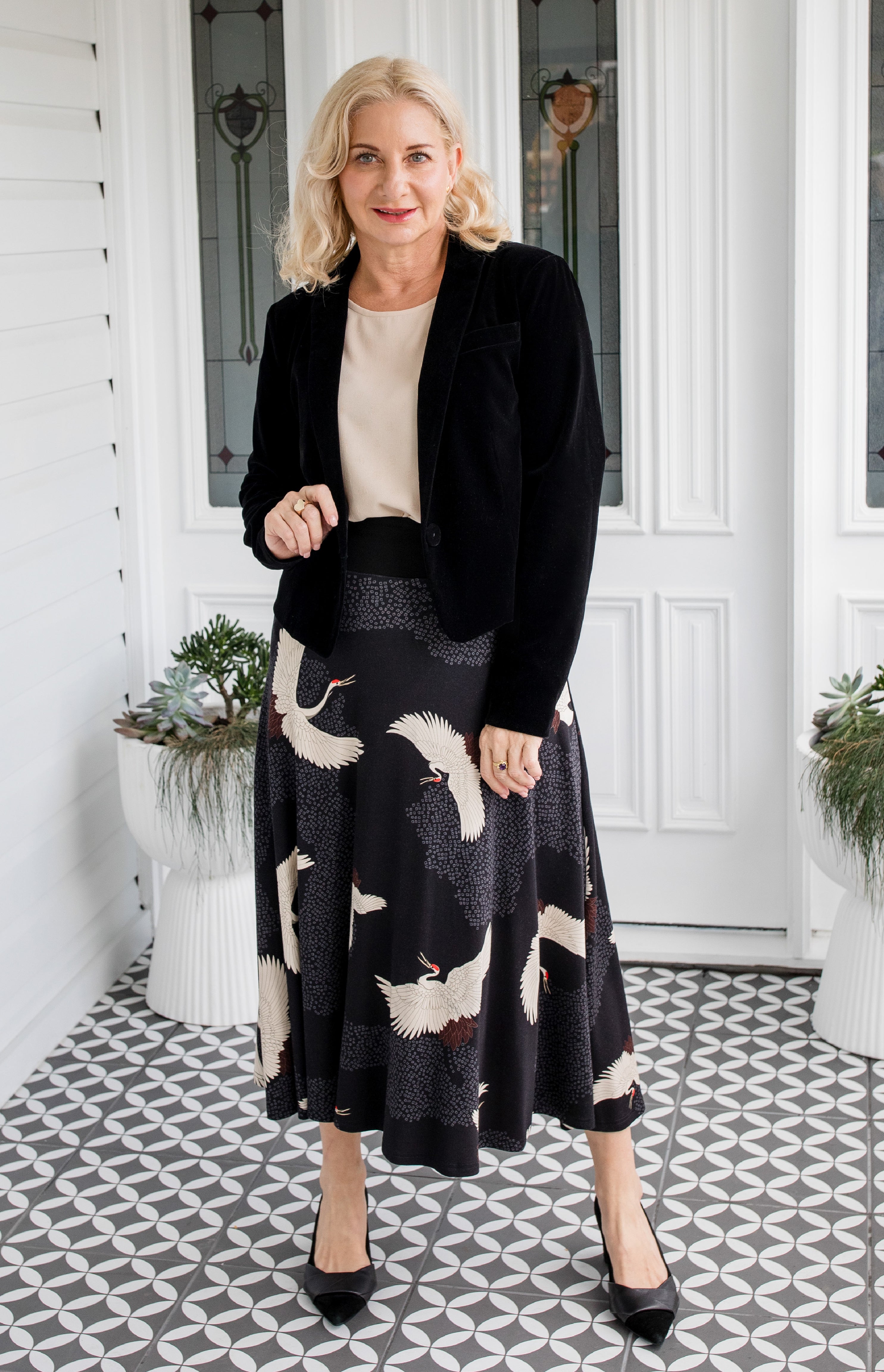 Model wearing Bamboo Must‑Have Skirt in Poetry in Motion black – flattering drape and stretch ponte waistband
