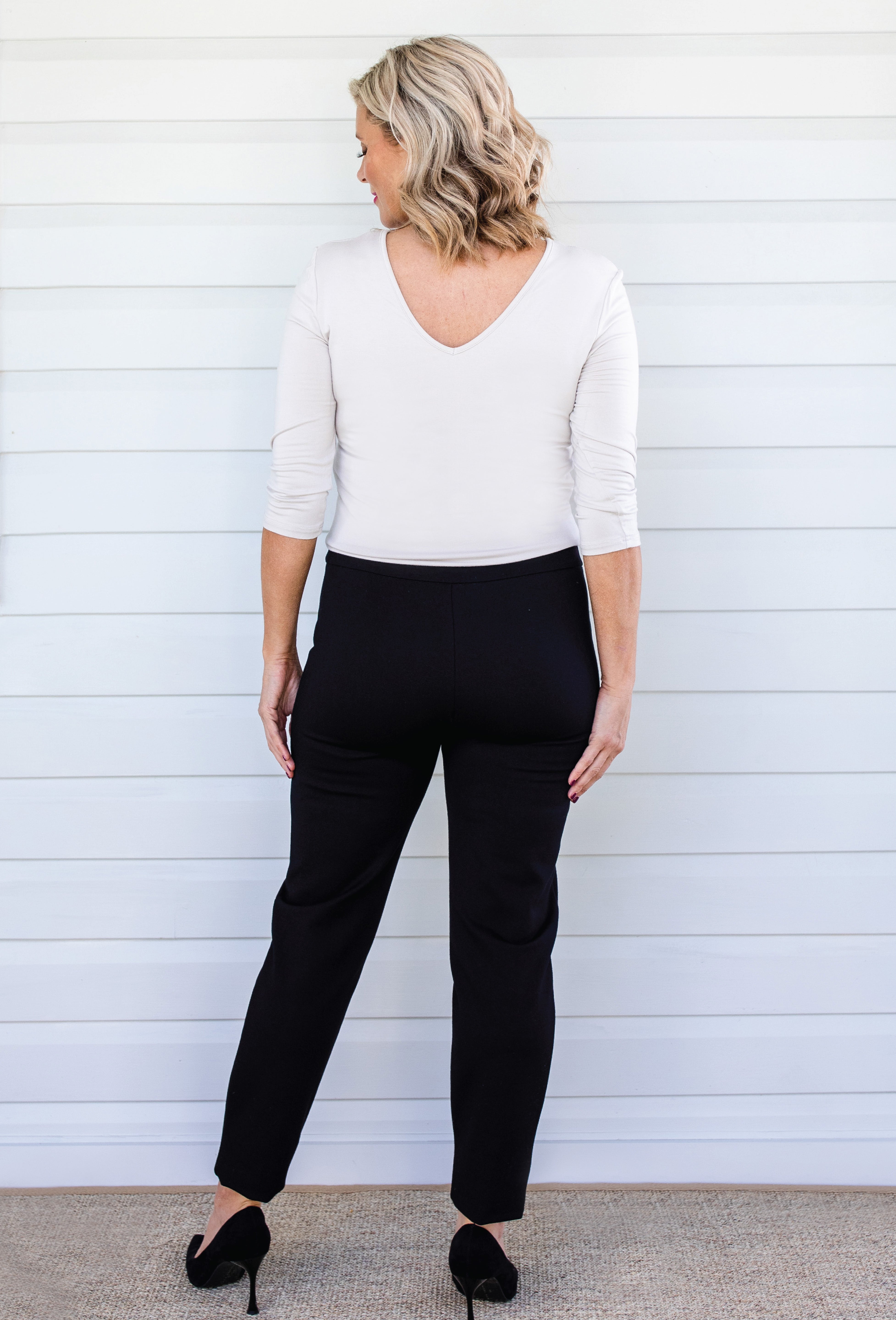 Back view of black Perfect Ponte Pant – clean line and straight-leg fall for elongating effect
