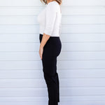 Side view of black Perfect Ponte Pant – clean line and straight-leg fall for elongating effect