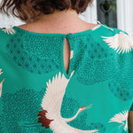 Button and loop neck opening on Poetry in Motion Green Poppy Top