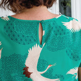 Button and loop neck opening on Poetry in Motion Green Poppy Top