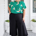 Model wearing Poppy Top in Poetry in Motion green - relaxed fit slip-on top with soft rayon
