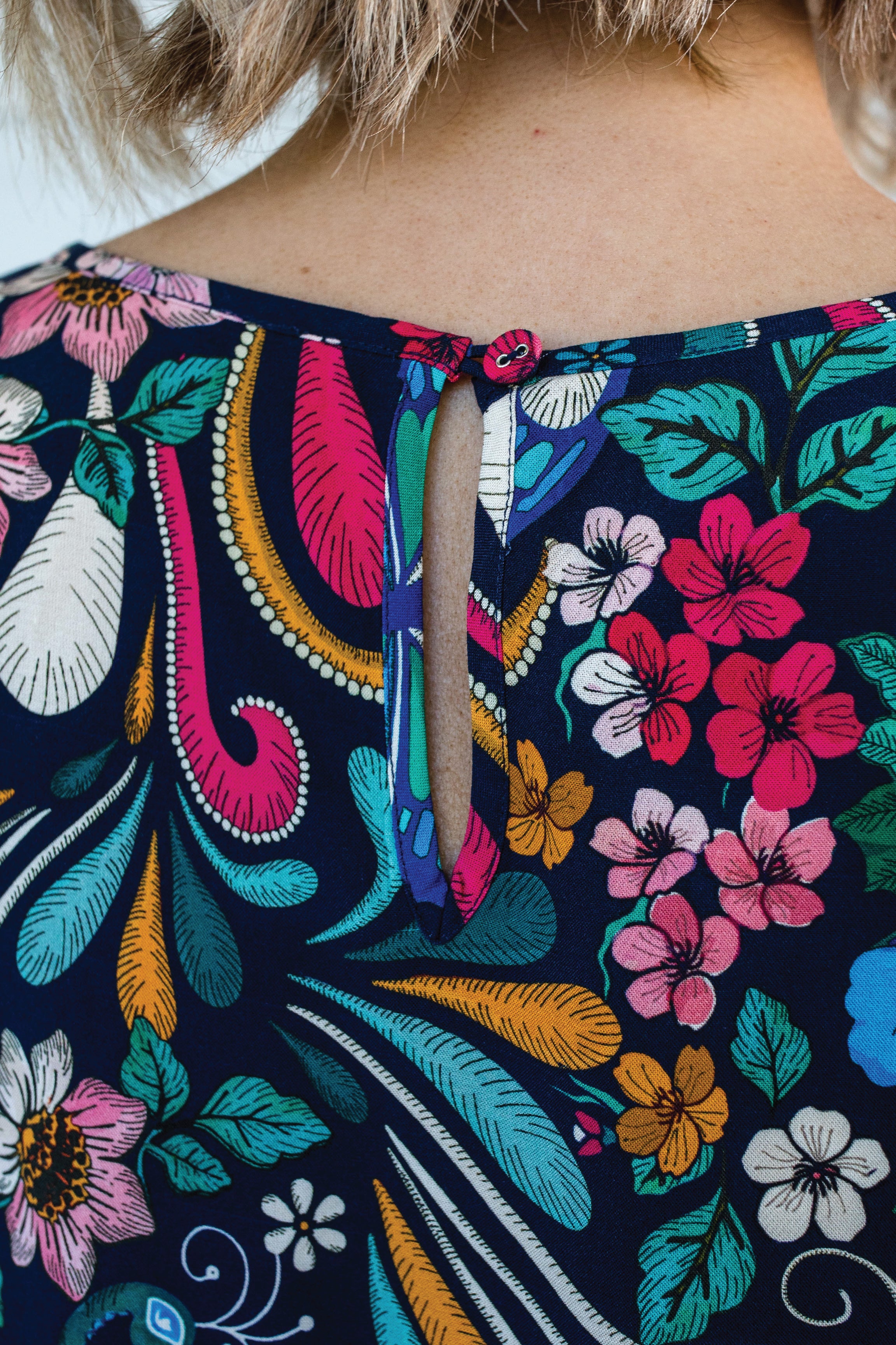 Button and keyhole detail at back neck of Poppy Top bestselling truly madly print