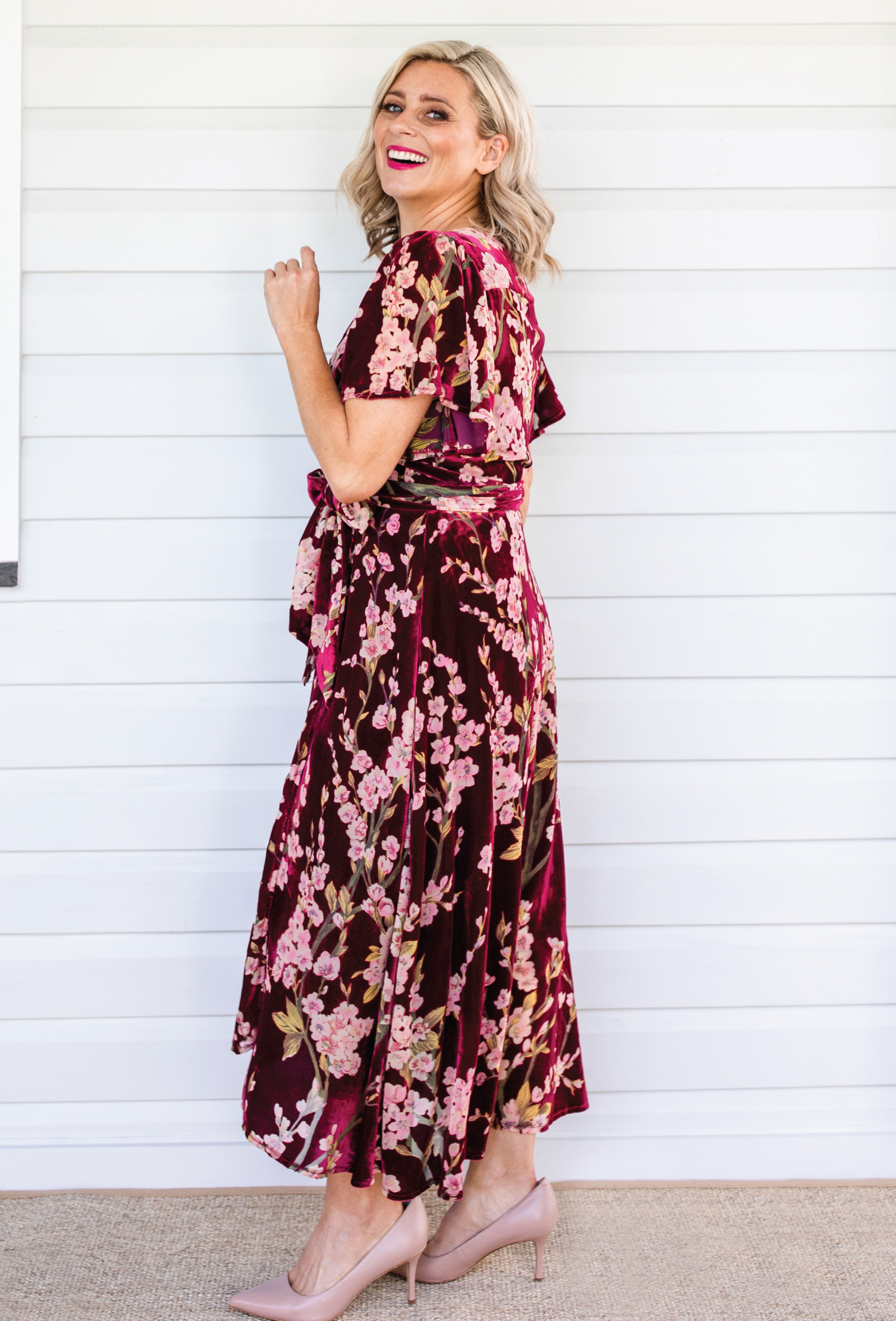 Side view of Violet Dress in blossom wine velvet – tie belt and flowing skirt