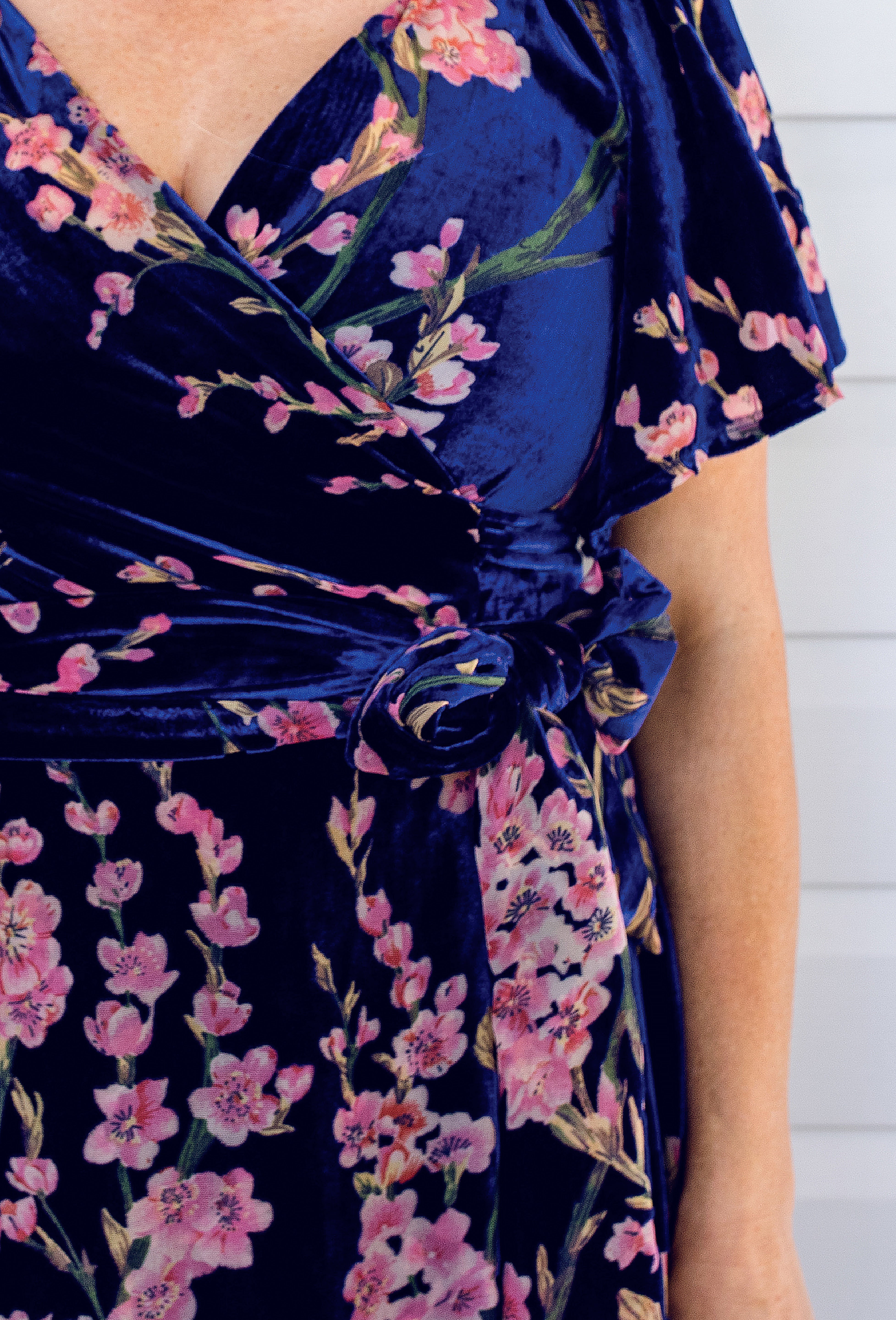 Close-up of blossom blue velvet fabric on the Violet Dress – soft luxurious velvet