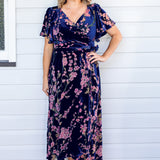 Maiocchi Violet Dress in blossom blue velvet – elegant flared wrap-style evening dress