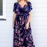 Model wearing Violet Dress in blossom blue velvet – flattering A-line silhouette