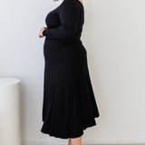 Side view of plain black Must Have Skirt – smooth drape and slim fit at waist