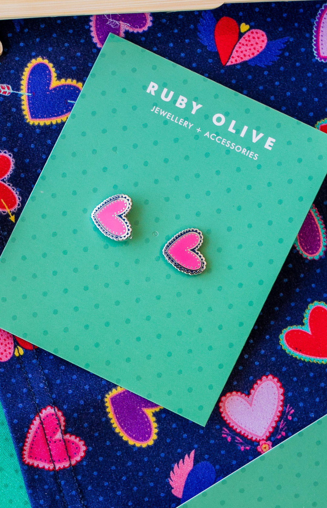 Ruby Olive Hearts Studs in pink silver